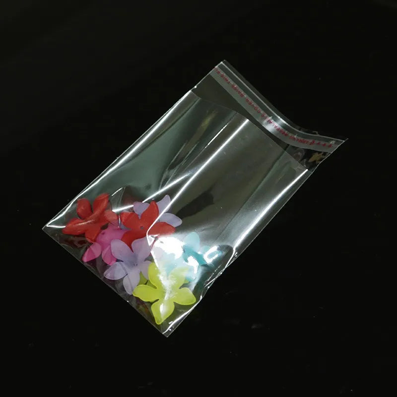 Self adhesive sealing transparent plastic bag, used for packaging jewelry, candy, biscuits, gifts, 100 pieces.